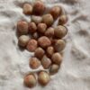 Zonnesteen edelsteen – steen van positiviteit, vitaliteit en creativiteit – spirituele steen voor sacraalchakra en zonnevlechtchakra